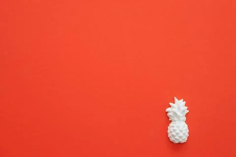 A plaster figure of a pineapple on a colored background Stock Photos