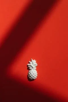 A plaster figure of a pineapple on a colored background Stock Photos