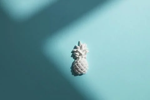 A plaster figure of a pineapple on a colored background Stock Photos