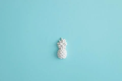 A plaster figure of a pineapple on a colored background Stock Photos