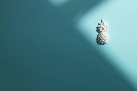 A plaster figure of a pineapple on a colored background Stock Photos
