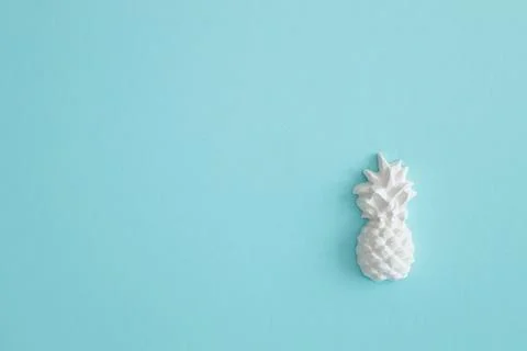 A plaster figure of a pineapple on a colored background Stock Photos