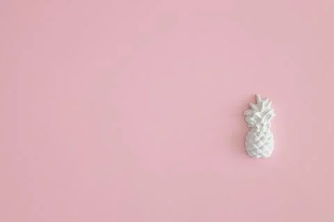 A plaster figure of a pineapple on a colored background Stock Photos