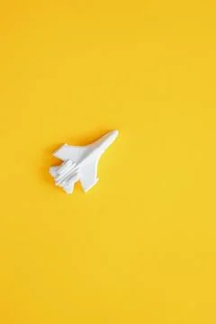 A plaster figure of a plane on a colored background Stock Photos