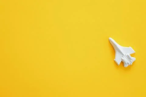 A plaster figure of a plane on a colored background Stock Photos