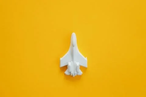 A plaster figure of a plane on a colored background Stock Photos