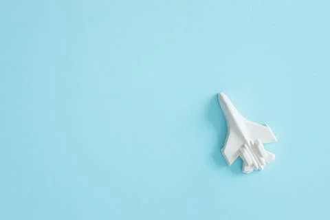 A plaster figure of a plane on a colored background Stock Photos