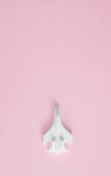 A plaster figure of a plane on a colored background Stock Photos