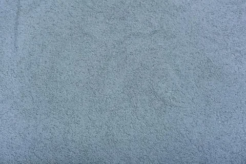 Plaster gray, fine texture of a concrete wall . Stock Photos