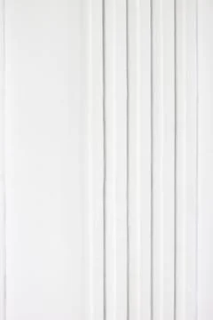 The plaster linear decoration on white wall Stock Photos