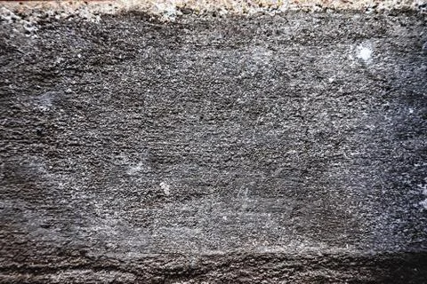 Plaster or cement texture dark gray color Stock Photos