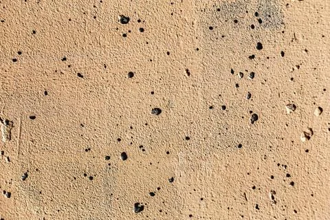 Plaster or cement texture yellow color Stock Photos