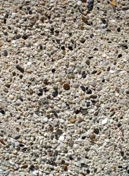 Plaster with  pebbles on wall closeup 库存照片