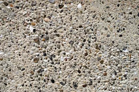 Plaster with pebbles on wall closeup Foto stock