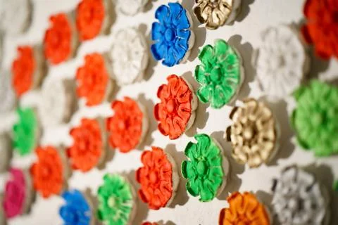 Plaster rosette, stucco in the form of flowers, leaves and flowers. backrou.. Stock Photos