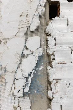 Plaster spall on the wall of a rough building in Caceres, Extremadura, Spain. Stock Photos