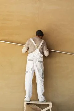 Plaster trimming process. Interior finishing works. Stock Photos