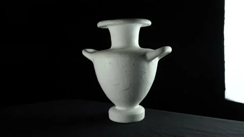 Plaster vase with counter light. Shot in a circle with beautiful shadows Stock Footage 137661472
