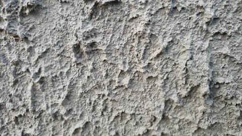 Plaster on the wall. Plastered wall, uneven, hard grunge. Facade of the building Stock Footage 244391238