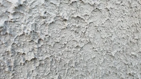 Plaster on the wall. Plastered wall, uneven, hard grunge. Facade of the building Stock Footage 244391874
