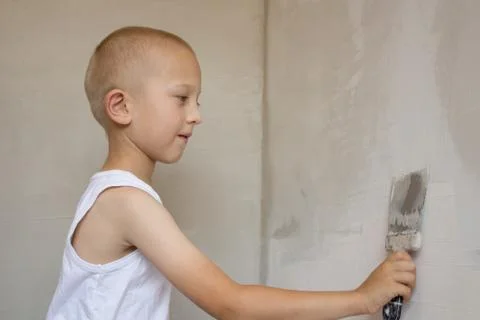 Plaster a wall with trowel Stock Photos