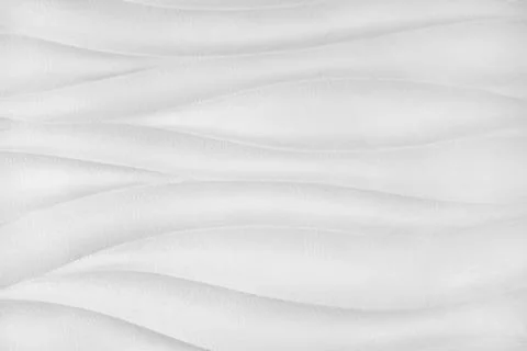 Plaster wall with volumetric relief surface wavy form pattern, white gypsum.. 写真素材