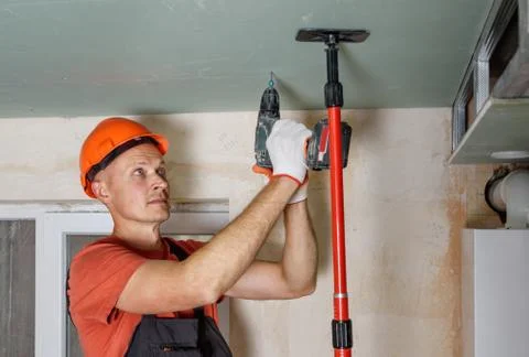 Plasterboard installation on the ceiling. Stock Photos