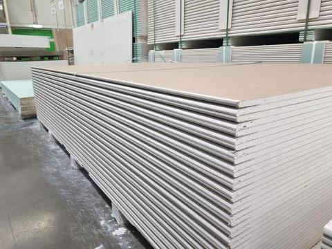 Plasterboard sheets stacked in a hardware store. building material. Stock Photos