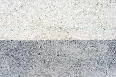 Plastered abstract two colored blue and white wall background. Stock Photos