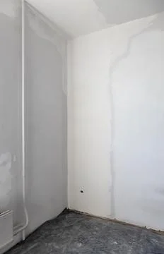 Plastered corner wall in the house. Stock Photos