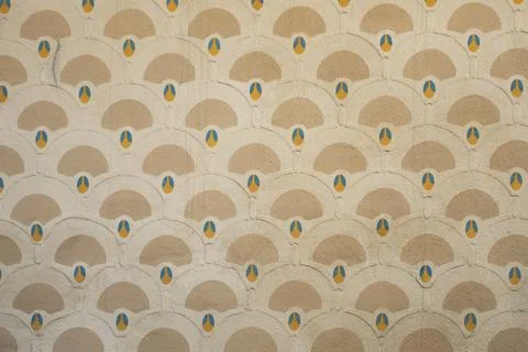 Plastered wall with art deco pattern in yellow beige and blue Stock Photos