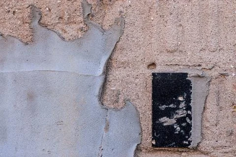 Plastered wall with a ceramic tile Stock Photos