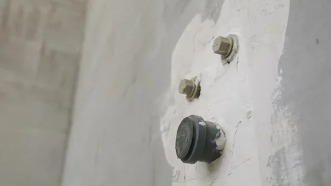 Plastered wall with outlets of plastic pipes for supplying cold and hot water. Stock Footage 294157993
