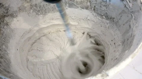 Plasterer is mixing grout with electrical drill Stock Footage 62881688