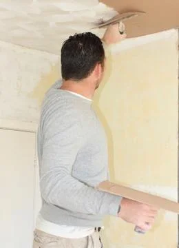 A plasterer plastering Stock Photos