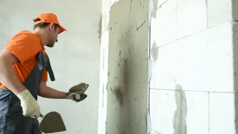 Plasterer putting plaster on wall. 4k Stock Footage 131398457