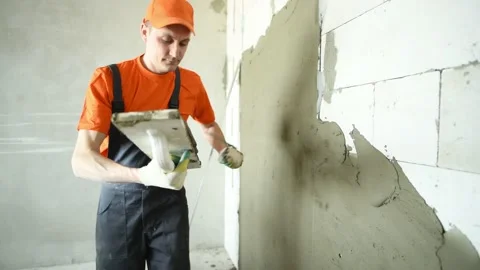 Plasterer putting plaster on wall. 4k Stock Footage 131398466