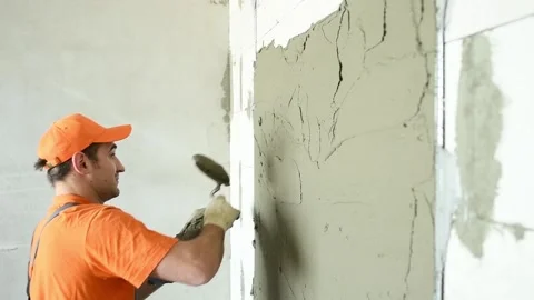 Plasterer putting plaster on wall. slow motion Stock Footage 88043075