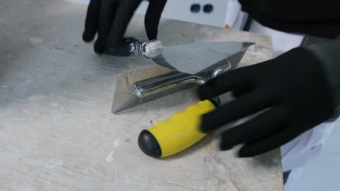 The plasterer is working. Applying decorative plaster to the wall Stock Footage 169331400