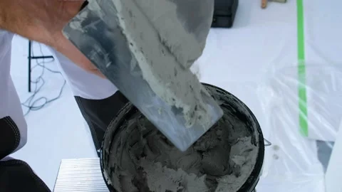 The plasterer is working. Applying decorative plaster to the wall Stock Footage 169331493