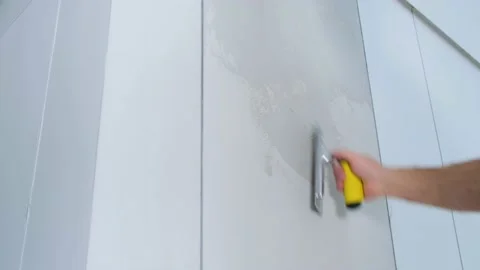 The plasterer is working. Applying decorative plaster to the wall Stock Footage 169331534