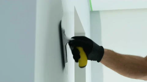 The plasterer is working. Applying decorative plaster to the wall Stock Footage 169331612