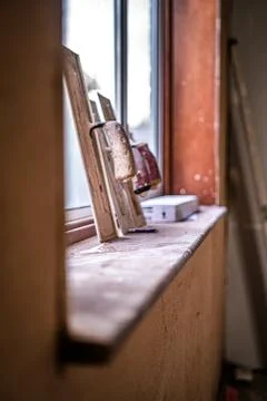 Plasterers  trowel tools in window Stock Photos