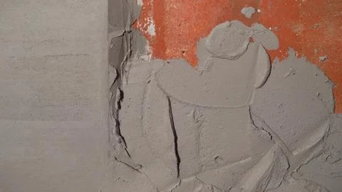 Plastering a brick wall, applying a layer of cement mortar Stock Photos