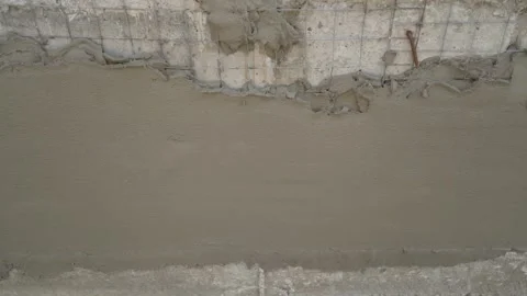 Plastering a Concrete Wall with Mesh Stock Footage 333531535