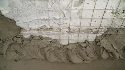 Plastering a Concrete Wall with Mesh Stock Photos
