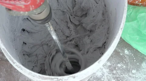 Plastering Material Mixing with Electric Drill Mixer Stock Footage 62896718