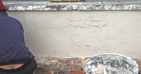 Plastering tool plaster marble on plaster rough, selective focus. Video stock 201024909