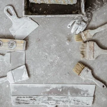 Plastering tools on cement background. Stock Photos