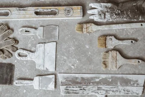 Plastering tools on cement background. Stock Photos